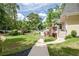 Expansive backyard with a swimming pool, mature trees, and tiered decking at 522 Golfview Dr, Peachtree City, GA 30269