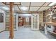 Finished basement featuring wood accents, tile floors, and double doors leading to an office space at 522 Golfview Dr, Peachtree City, GA 30269