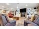 Basement Gathering room with fire place, built-in shelving and pool table at 522 Golfview Dr, Peachtree City, GA 30269