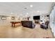 Finished basement with a pool table, fireplace, built in shelving and Gathering room at 522 Golfview Dr, Peachtree City, GA 30269