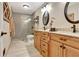 Modern bathroom featuring double vanity, tiled shower, and updated fixtures at 522 Golfview Dr, Peachtree City, GA 30269