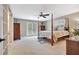 Bedroom featuring a four-poster bed and French doors at 522 Golfview Dr, Peachtree City, GA 30269
