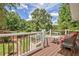 Outdoor deck features seating with pool view and lush greenery, perfect for relaxation at 522 Golfview Dr, Peachtree City, GA 30269