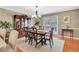 Dining room featuring wood floors, a stylish chandelier, and built in china cabinet for storage at 522 Golfview Dr, Peachtree City, GA 30269