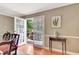 Dining room with hardwood floors and views to deck via glass doors at 522 Golfview Dr, Peachtree City, GA 30269