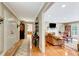 Charming entryway featuring hardwood floors and opening to the living room and glimpses of the kitchen at 522 Golfview Dr, Peachtree City, GA 30269