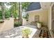 Charming courtyard with fountain, decorative plants, and a secure gate leading to the front entrance at 522 Golfview Dr, Peachtree City, GA 30269