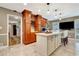 Spacious kitchen featuring an island, custom cabinetry, and a view into an adjacent room at 522 Golfview Dr, Peachtree City, GA 30269