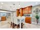Bright kitchen features a center island with seating, pendant lighting, and custom wood cabinetry at 522 Golfview Dr, Peachtree City, GA 30269