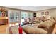 Spacious living room featuring hardwood floors, french doors, and a comfortable seating area at 522 Golfview Dr, Peachtree City, GA 30269