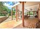Large covered patio perfect for entertaining, with hot tub, outdoor kitchen, and access to beautifully landscaped yard at 522 Golfview Dr, Peachtree City, GA 30269