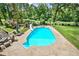 Aerial view of a large backyard pool and patio area, perfect for outdoor entertaining and relaxation at 522 Golfview Dr, Peachtree City, GA 30269