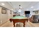Close-up of a wooden pool table in the basement at 522 Golfview Dr, Peachtree City, GA 30269