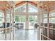 Inviting sunroom with wood ceiling, tile floors, and french doors to a covered porch at 522 Golfview Dr, Peachtree City, GA 30269