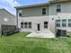 Backyard features a small patio and lawn, offering a private outdoor space for relaxation and recreation at 5512 Cascade Run, Atlanta, GA 30336