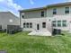 Backyard view of a grassy area and patio at 5512 Cascade Run, Atlanta, GA 30336