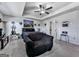 Comfortable bedroom showcasing a tray ceiling with fan, complemented by neutral tones and comfortable furnishings at 5512 Cascade Run, Atlanta, GA 30336