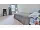 A simple but sunny bedroom with a neatly made bed, carpeted floor, and a big window at 5512 Cascade Run, Atlanta, GA 30336