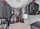 Walk-in closet with custom shelving and storage space for clothing and accessories at 5512 Cascade Run, Atlanta, GA 30336