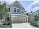 Inviting two-story home features a gray exterior, attached two-car garage, and well-maintained landscaping at 5512 Cascade Run, Atlanta, GA 30336