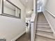 Bright hallway featuring a staircase with carpeted steps, leading to the home's upper level at 5512 Cascade Run, Atlanta, GA 30336