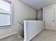 Landing at the top of the stairs featuring neutral decor and window for ample light at 5512 Cascade Run, Atlanta, GA 30336