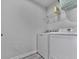 This bright laundry room features modern appliances and useful storage at 5512 Cascade Run, Atlanta, GA 30336