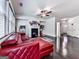 Bright living room with hardwood floors, modern fireplace, and comfortable red leather seating at 5512 Cascade Run, Atlanta, GA 30336