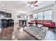Open concept living space with dark wood floors and accents, stainless steel appliances, and comfortable seating at 5512 Cascade Run, Atlanta, GA 30336