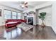 Bright living room with hardwood floors, modern fireplace, and comfortable red leather seating at 5512 Cascade Run, Atlanta, GA 30336