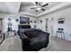 Spacious main bedroom with tray ceiling, seating area and large windows at 5512 Cascade Run, Atlanta, GA 30336
