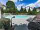 Community pool area with lounge chairs and landscaped surroundings at 5512 Cascade Run, Atlanta, GA 30336