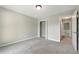 Bedroom featuring neutral walls, carpet floors, and a door at 75 Fox Chase, Covington, GA 30016