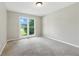 Bedroom featuring neutral walls, carpet floors, and a window at 75 Fox Chase, Covington, GA 30016