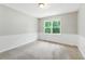 Bedroom featuring neutral walls, carpet floors, and a window at 75 Fox Chase, Covington, GA 30016