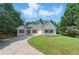 Charming single-story home featuring stone accents, fresh exterior paint and a well-manicured lawn at 75 Fox Chase, Covington, GA 30016