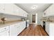 Well-maintained kitchen with white cabinets, granite countertops, and modern stainless steel appliances at 75 Fox Chase, Covington, GA 30016