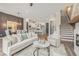 Open-concept living room flows into dining area and kitchen, showcasing modern design at 937 Willingham Dr # 7, Hapeville, GA 30354