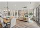 Open living space boasts a fireplace, dining area and kitchen for seamless entertaining and relaxation at 937 Willingham Dr # 7, Hapeville, GA 30354