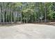 Home with a private basketball court surrounded by mature trees at 2019 Aldbury Ln, Woodstock, GA 30189