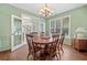 Charming dining room with hardwood floors, decorative chandelier, and natural light, perfect for gatherings at 2019 Aldbury Ln, Woodstock, GA 30189