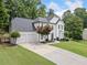 Beautifully landscaped traditional-style home with a large front yard and a convenient three-car garage at 2019 Aldbury Ln, Woodstock, GA 30189