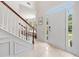 Grand foyer with a staircase, tile flooring, and an abundance of natural light at 2019 Aldbury Ln, Woodstock, GA 30189