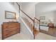 Elegant foyer with staircase, hardwood floors, and a view into the living room at 2019 Aldbury Ln, Woodstock, GA 30189