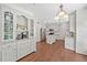 Bright, newly renovated kitchen with white cabinets, granite countertops, and stainless steel appliances at 2019 Aldbury Ln, Woodstock, GA 30189