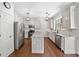 Modern kitchen with granite countertops, stainless steel appliances, and a center island at 2019 Aldbury Ln, Woodstock, GA 30189