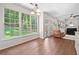 Living room view to backyard with natural light, hardwood floors, and open layout near the kitchen at 2019 Aldbury Ln, Woodstock, GA 30189