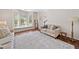 Comfortable living room featuring a large window seat, hardwood floors, and neutral paint at 2019 Aldbury Ln, Woodstock, GA 30189