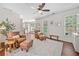Inviting sitting area with hardwood floors, neutral colors, and lots of natural light at 2019 Aldbury Ln, Woodstock, GA 30189