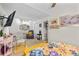 Bright room showcasing a TV, stylish mirror, and sitting area with a soft, cozy chair at 2030 Buford Dam Rd, Buford, GA 30518